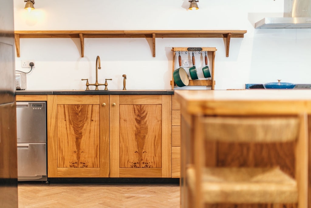 Traditional fitted kitchen with handcrafted wooden cabinetry